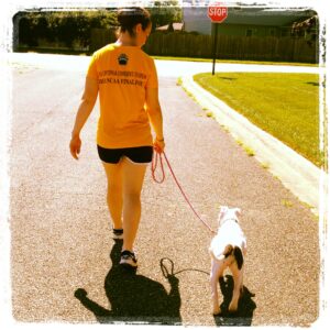 Nicole guides Willow to proper leash manners early on in life to prevent any issues later on.
